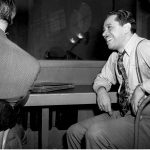 Jazz musician and band leader Cab Calloway is shown in the control room as he hears the playback of his first 1947 recording session with his orchestra at Columbia studio, New York City, March 12, 1947. (AP Photo)