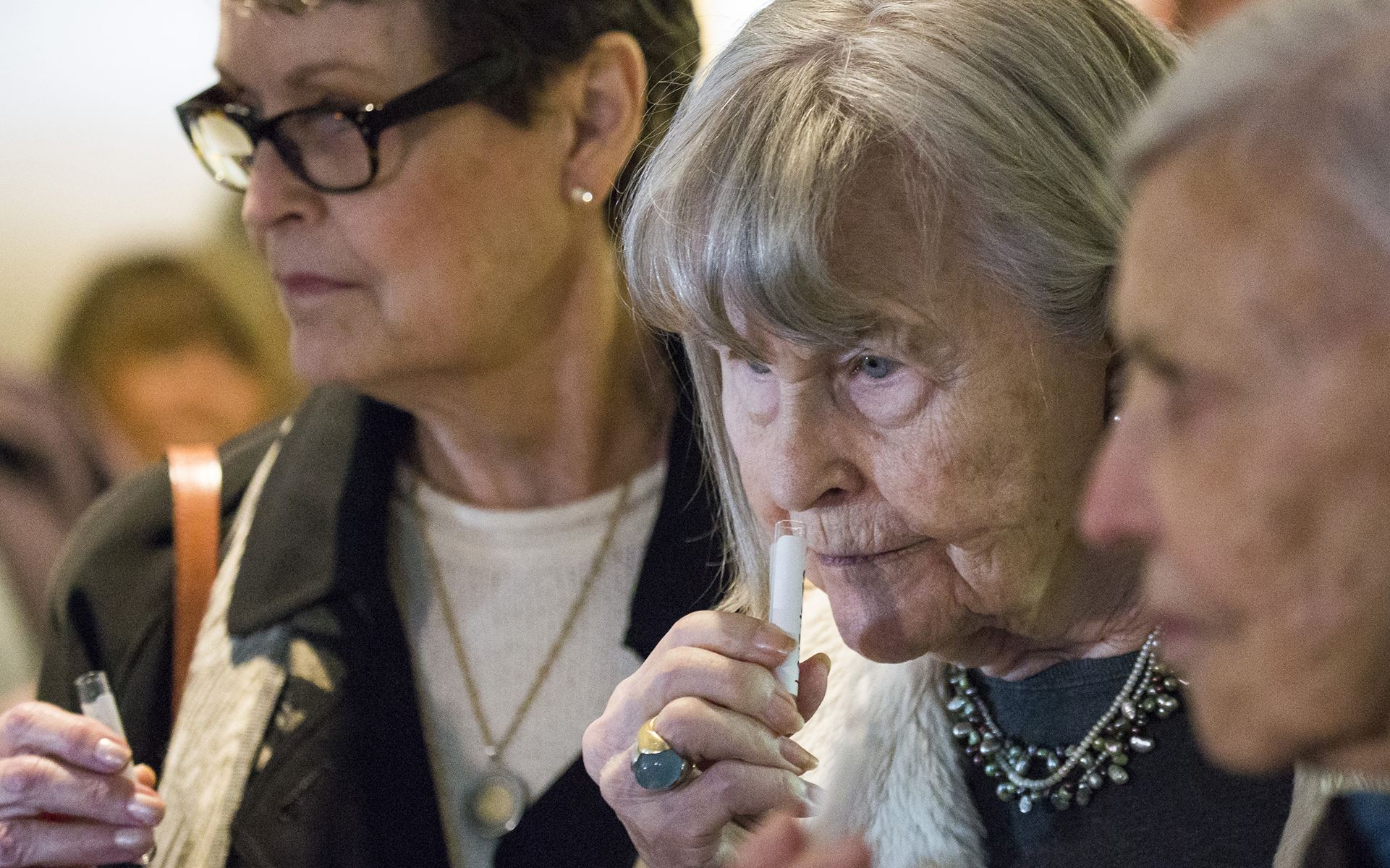 Ilene Cohn smells a pipette containing terpenes and essential oils at Vela Cannabis in Seattle, Washington on March 16, 2017. Cohn was part of a group from Sound Vista Village, an assisted living facility in Gig Harbor, that visited Vela Cannabis. (Photo by David Ryder/Leafly)