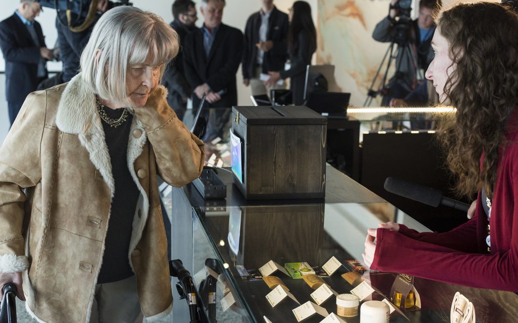 Ilene Cohn, left, shops with assistance from Elena Mishko, right, an employee at Vela Cannabis in Seattle, Washington on March 16, 2017. Cohn was part of a group from Sound Vista Village, an assisted living facility in Gig Harbor, that visited Vela Cannabis. (David Ryder for Leafly)