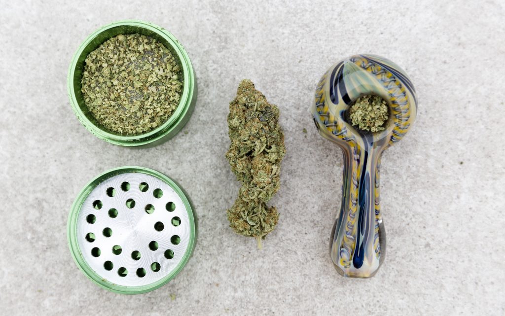 Marijuana Pipe, grinder and nug.