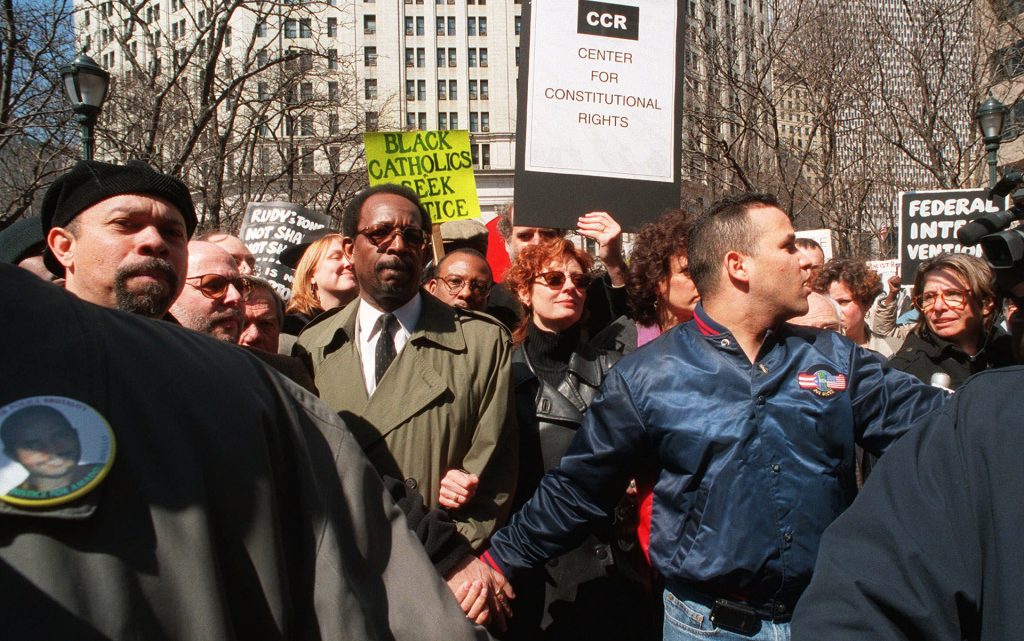 Actor Susan Sarandon, center, takes part in a protest at New York's police headquarters Thursday, March 25, 1999. Sarandon was among 219 people arrested for blocking the entrances to police headquarters, the largest group so far in a string of daily protests against the police killing of an unarmed African immigrant. (Mitch Jacobson/AP)