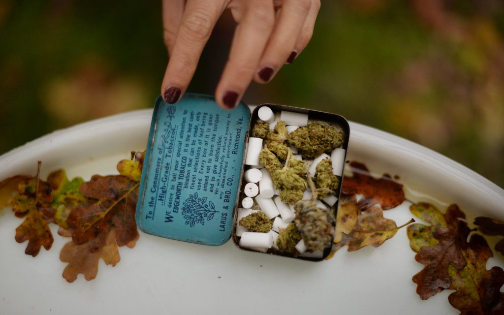 An attendee from Chico, California with their homegrown cannabis in a tin at The Emerald Cup held at the Sonoma County Fairgrounds in Santa Rosa, California. (Erik Castro for Leafly)