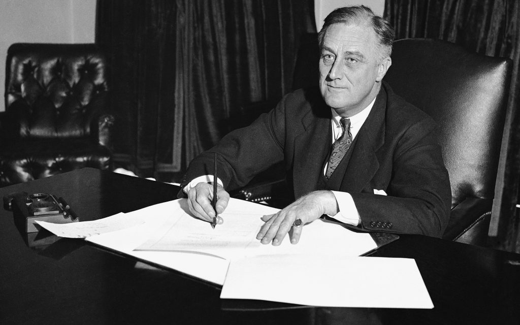 Franklin D. Roosevelt signing Cullen-Harrison Act during alcohol prohibition