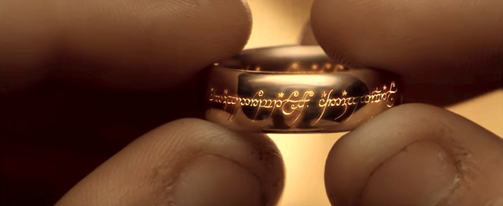 Frodo examining the ring in The Fellowship of the Rings
